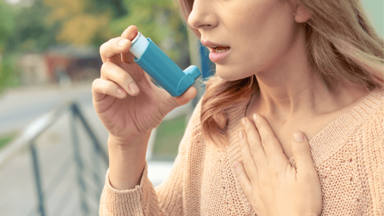 Closeup view of woman using asthma inhaler outdoors, space for text. Banner design. Image Credit: Adobe Stock Images/New Africa