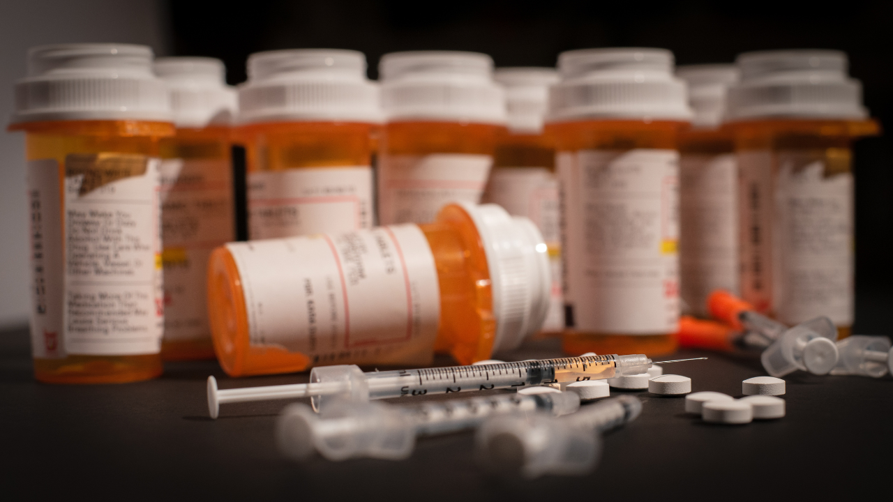 Hypodermic Needle and Prescription Pills. Image Credit: Adobe Stock Images/Darwin Brandis